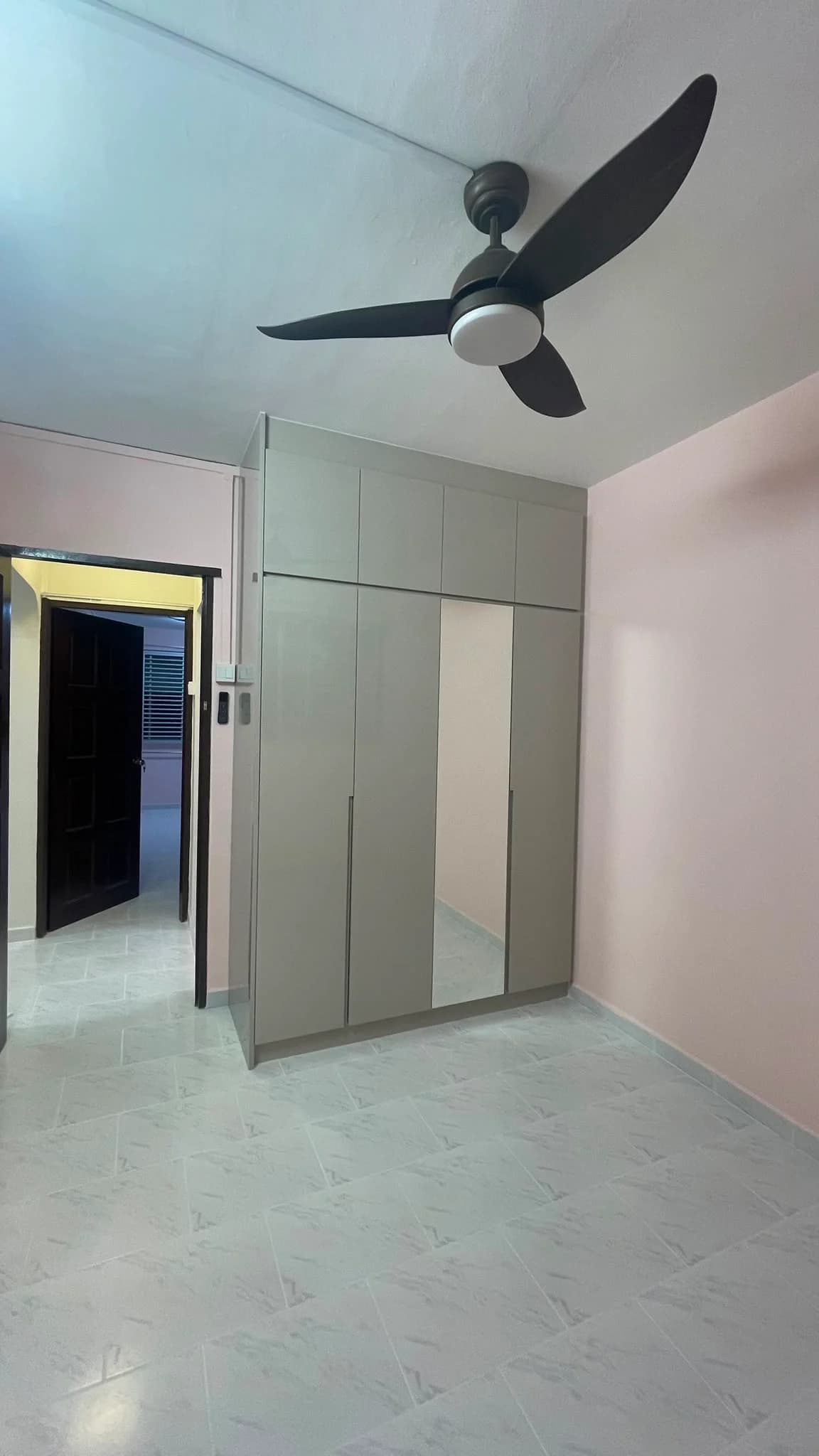 Bedroom wardrobe with a full-length mirrored door