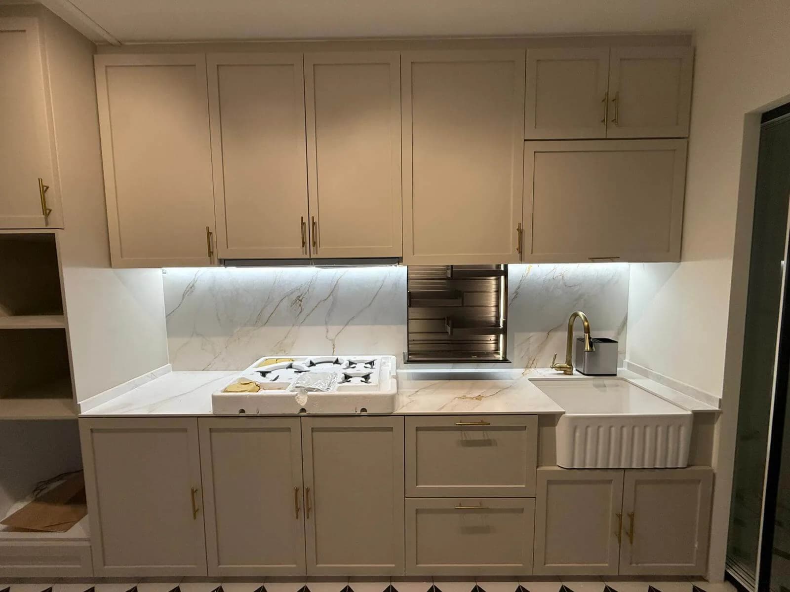 Completed kitchen with fitted cabinets and worktops