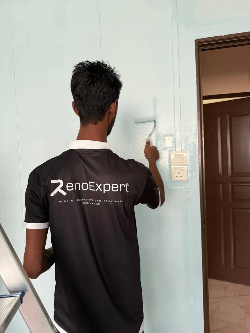 RenoExpert painting work in progress at a renovation site